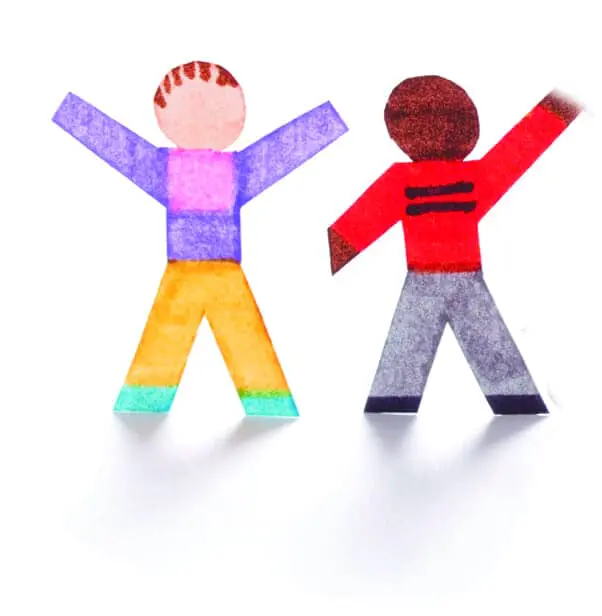 Two paper cutouts of children with their arms raised to represent disability awareness and inclusion.