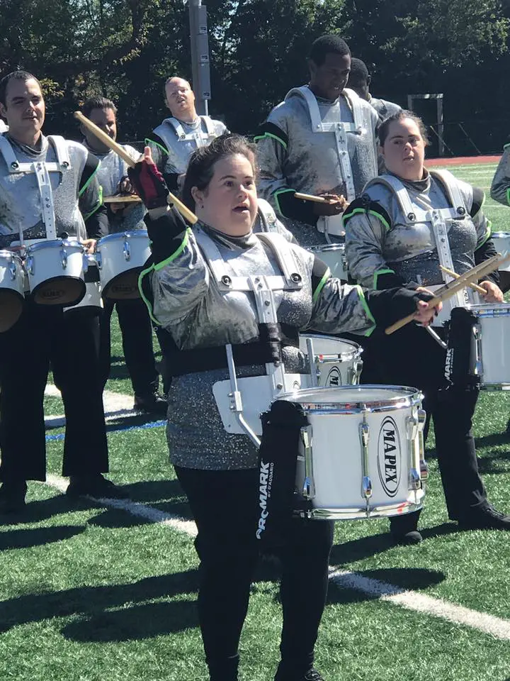FREE Players Drum & Bugle Corps members in uniform playing drums.