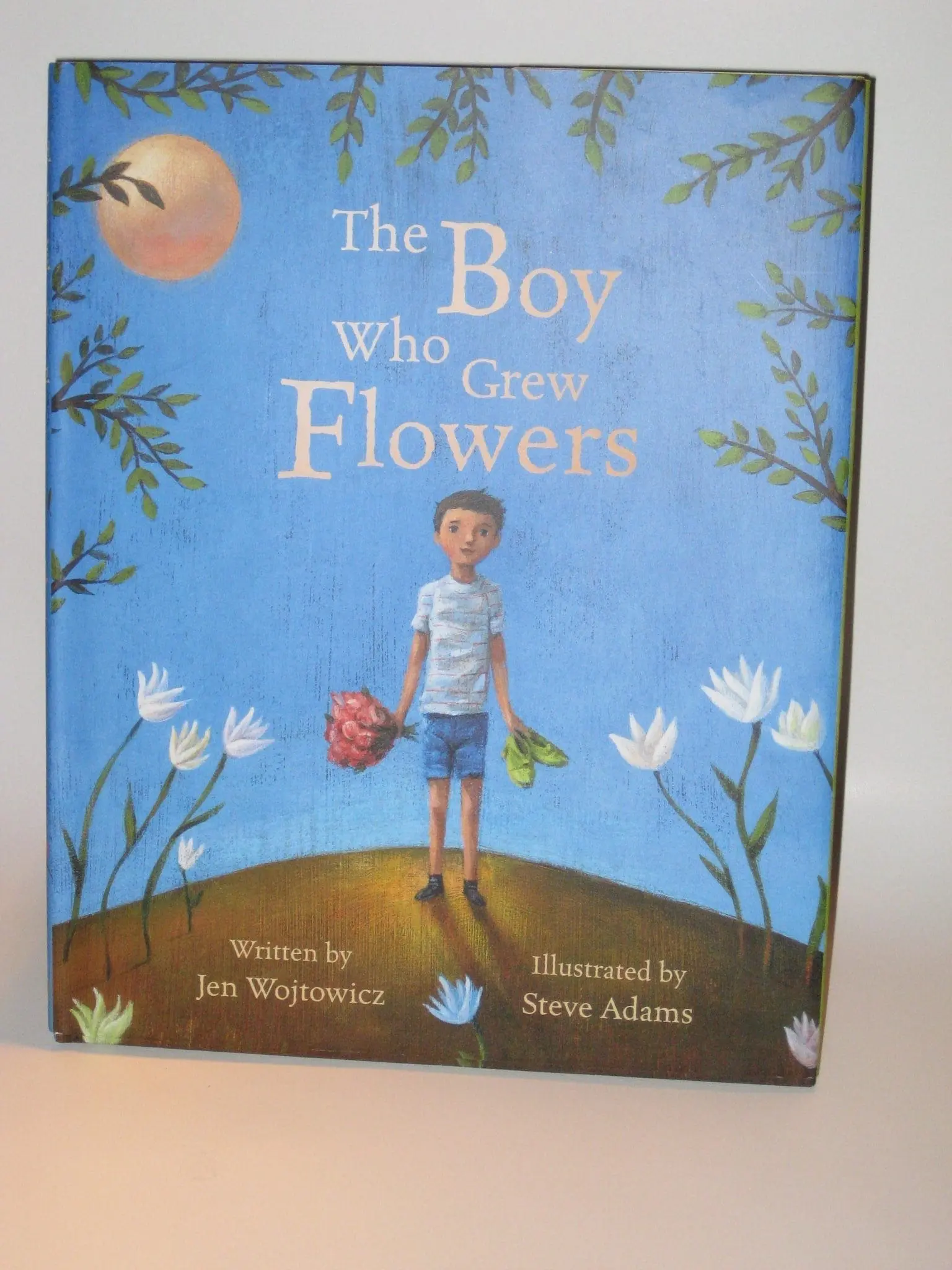 Cover of the book "The Boy Who Grew Flowers" by Jen Wojtowicz and illustrated by Steve Adams.