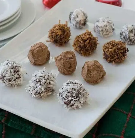 Assortment of sunbutter truffles on a white platter