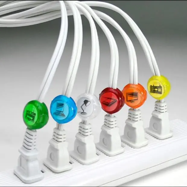 Color-coded cord identifiers on plugs in a power strip