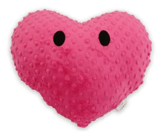 A bright pink heart-shaped pillow with black button eyes.