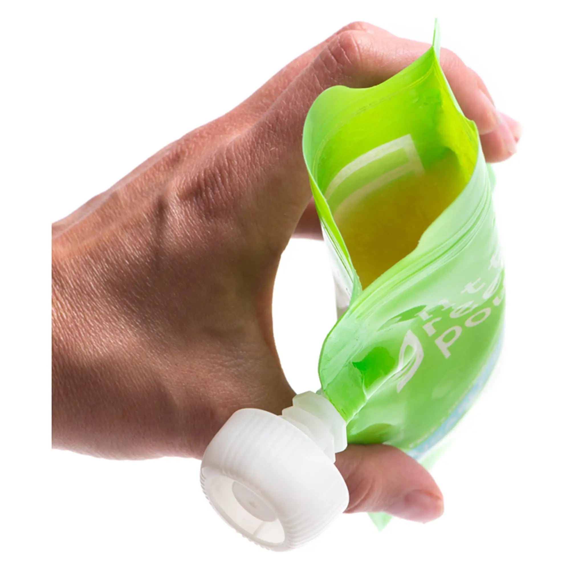 A hand holds a reusable green food pouch.