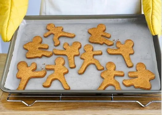 Ninja-shaped gingerbread cookies on a baking sheet.