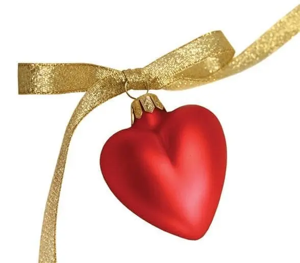 Red heart ornament with a gold ribbon.