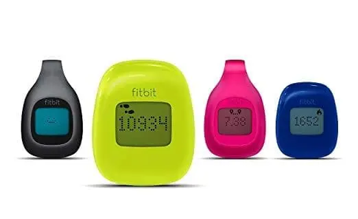 Four Fitbit Zip activity trackers in different colors.