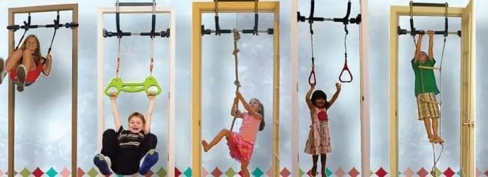 Children using various indoor jungle gym attachments mounted in doorframes.