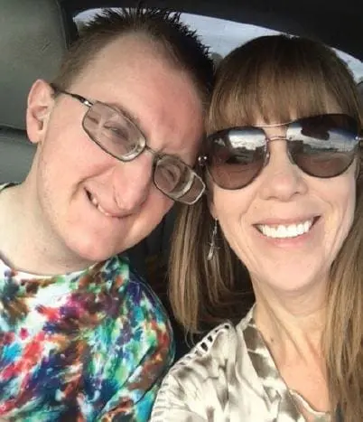 Liz and Joey Petruzzi smiling for a photo.