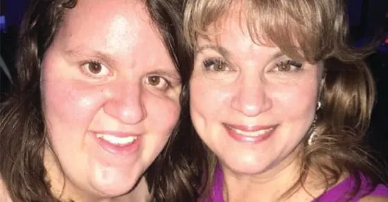 Two women smiling at the camera