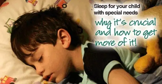A young boy sleeps peacefully in bed next to a stuffed animal.