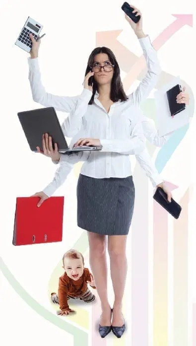 Woman juggling multiple tasks with baby at her feet