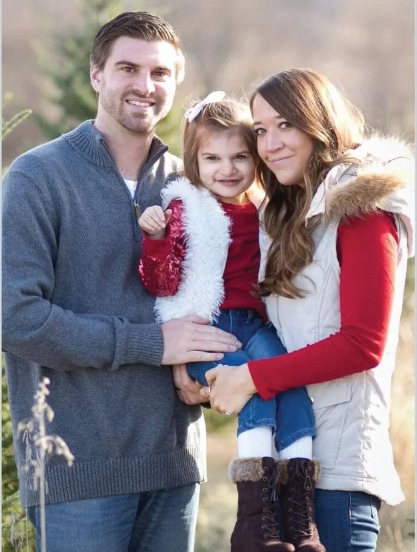 Sandiford family posing for a photo outdoors.