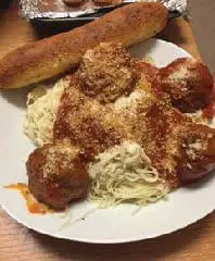Spaghetti and meatballs with a side of bread