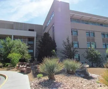 Surgery Survival Hospital building with landscaping in front.