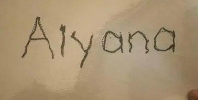 Aiyana handwritten on a light background.