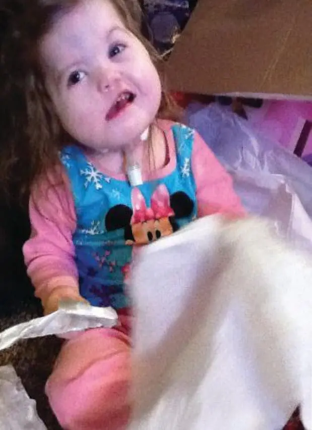 Grace Hope in a pink and blue shirt with Minnie Mouse on it.