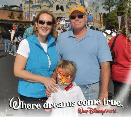 A family poses in front of Cinderella's Castle at Walt Disney World.