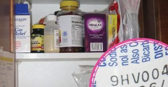 Shelves stocked with various medicine bottles and boxes.