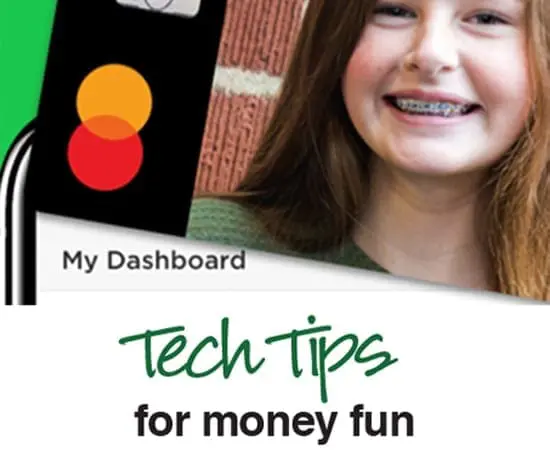 A smiling girl with braces looks at the camera next to a black device with two circles.