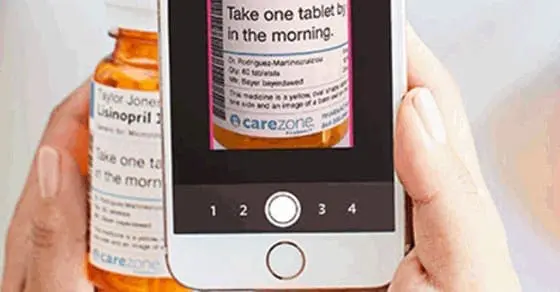 Phone scanning a prescription bottle's label.