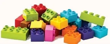 Pile of colorful building blocks with studs