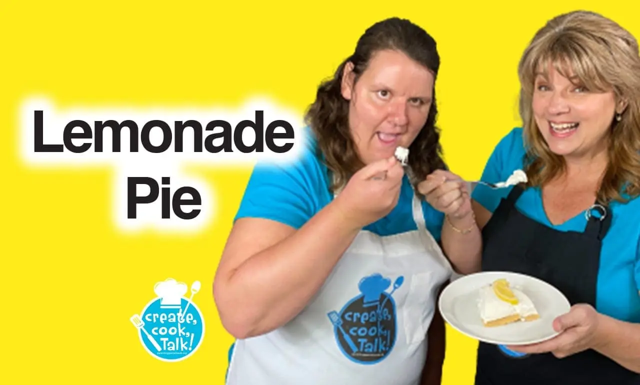 Carrie Antonelli and another woman smile while holding lemonade pie.