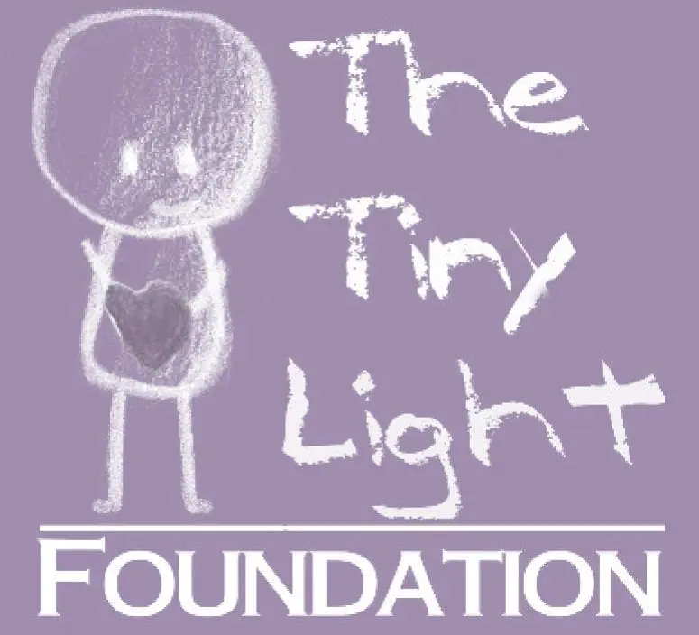 The Tiny Light Foundation logo with a child illustration.