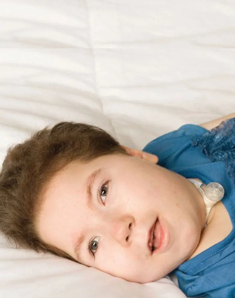 Emily lying on her side, looking towards the camera.
