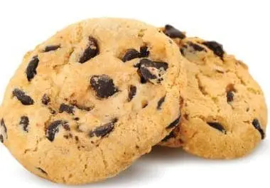Two chocolate chip cookies on a white background.