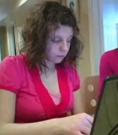 Carly Fleischman working on a laptop.