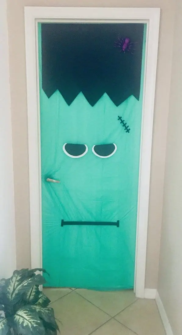 Door decorated to look like a Frankenstein monster for Halloween.