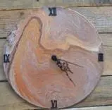 Circular multi-media art clock with Roman numerals and swirled paint design.