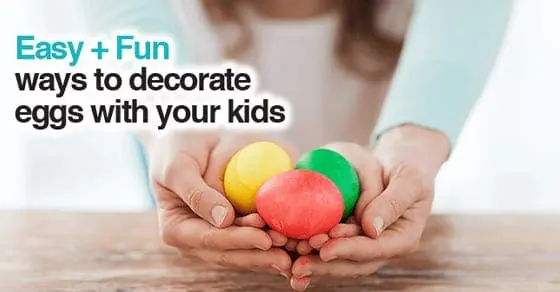 Hands holding three colorful Easter eggs: yellow, red, and green.