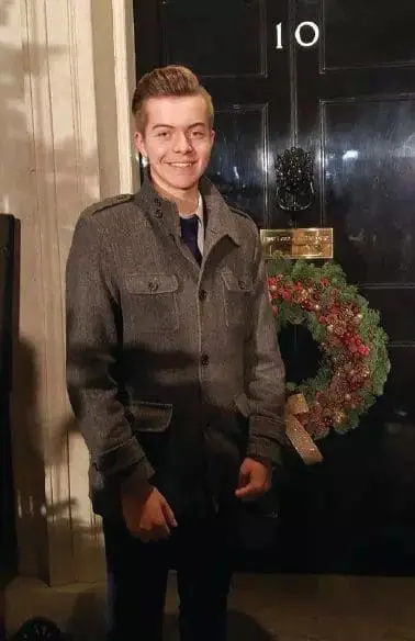 Mikey standing in front of the door at 10 Downing Street.
