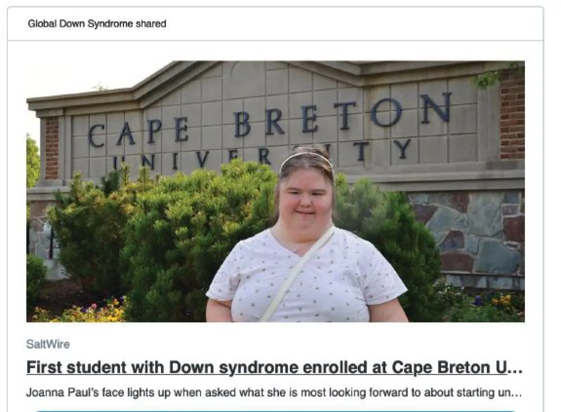 Joanna Paul smiles in front of Cape Breton University.