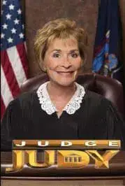 Judge Judy smiling behind a desk with the Judge Judy logo.