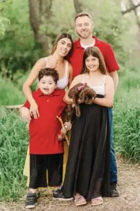 Rachel Hurtado with her family and a dog.