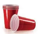 Stack of red plastic cups and one cup lying on its side