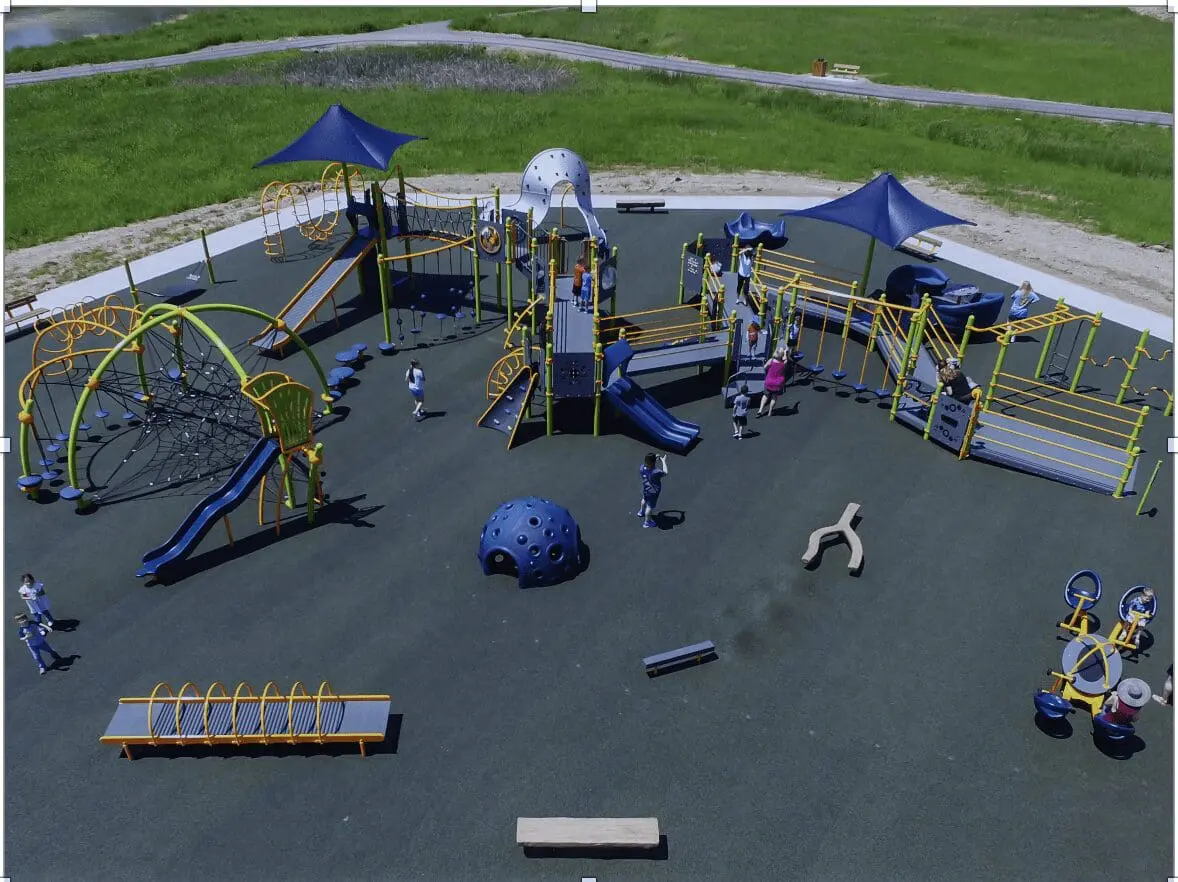 Aerial view of an inclusive playground with various accessible play structures.