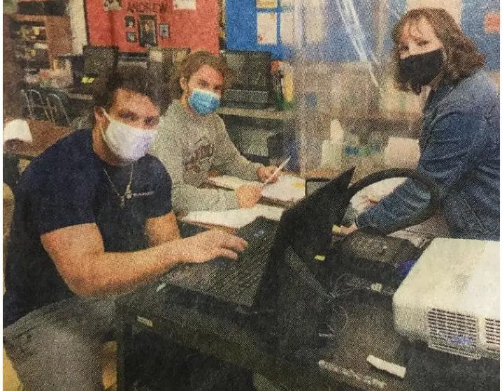 Alicia Muzina works with students in the Helping Hands Program at Canfield School District.