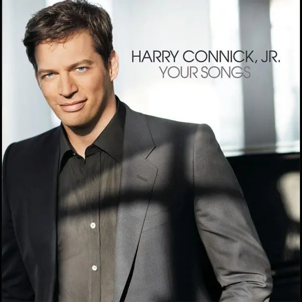 Harry Connick Jr. wearing a suit jacket and black shirt.