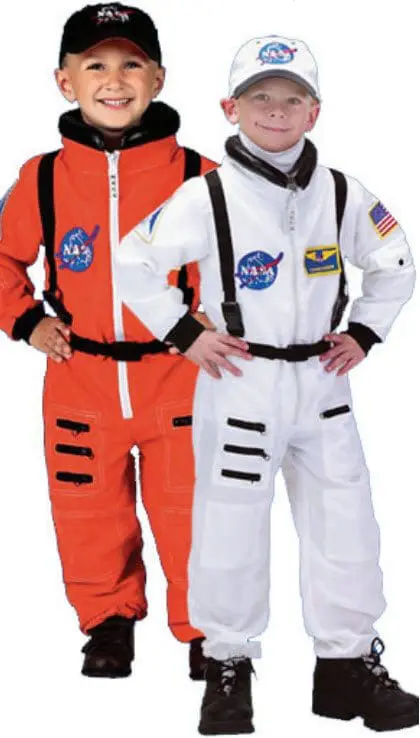 Two children wear astronaut costumes, one orange and one white.