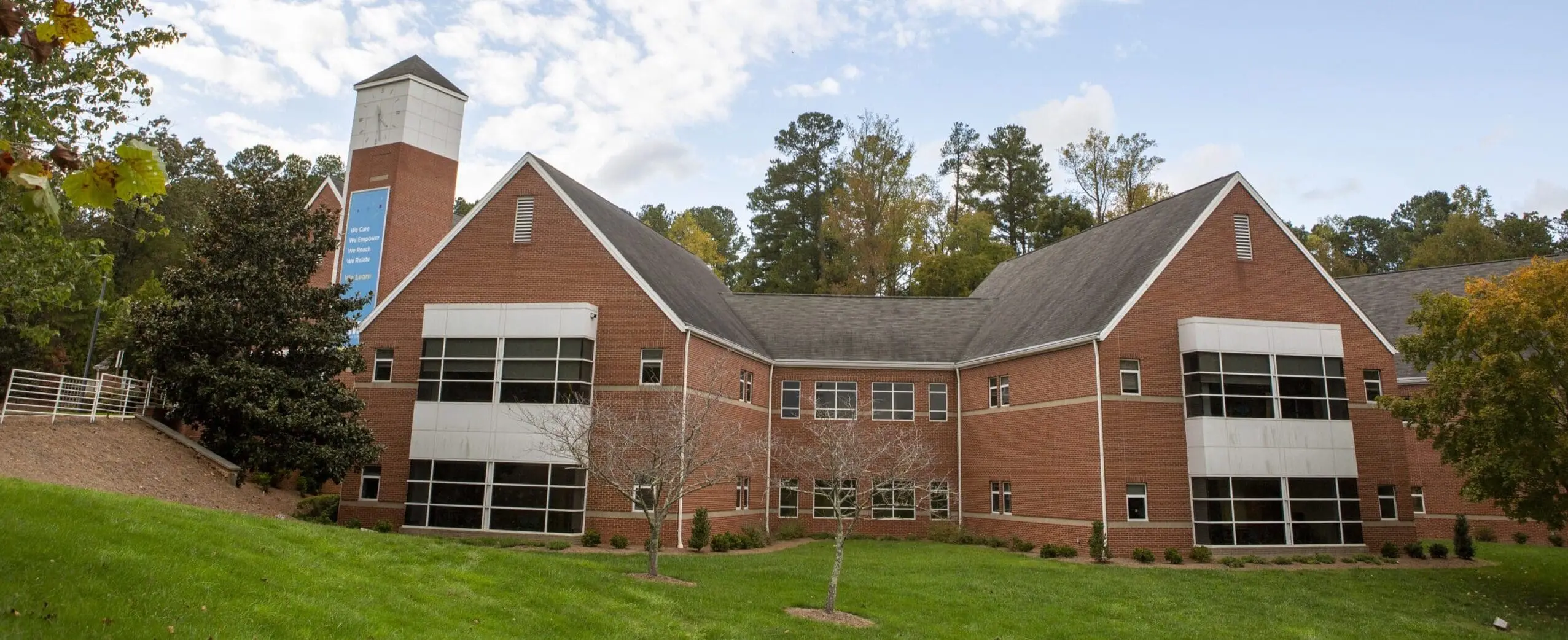 Hill Learning Center building exterior and grounds under a cloudy sky.