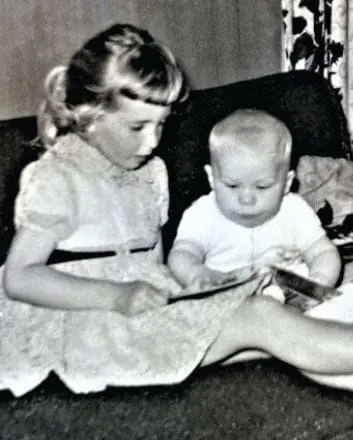 Patricia reading to her cousin.