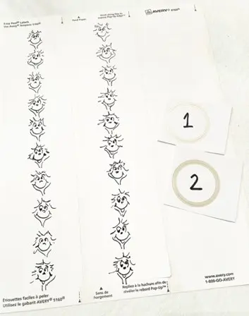 Strips of paper with printed Dr. Seuss characters and two numbered circles.