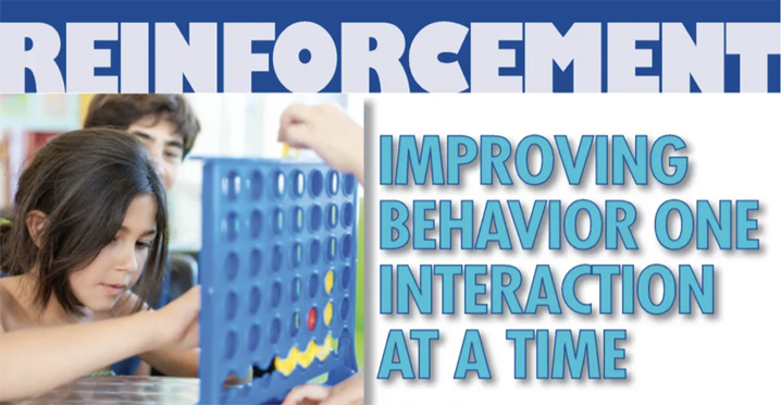 Children playing a Connect Four game.