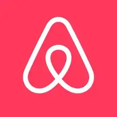 Airbnb logo on a red background.