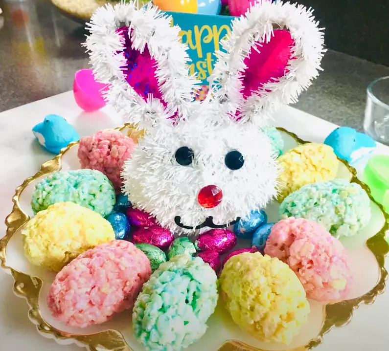 Easter bunny surrounded by colorful Rice Krispie treats.