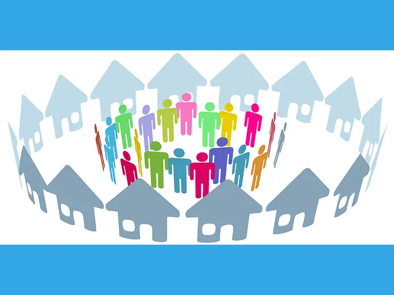 Colorful people icons stand in a circle surrounded by house icons.