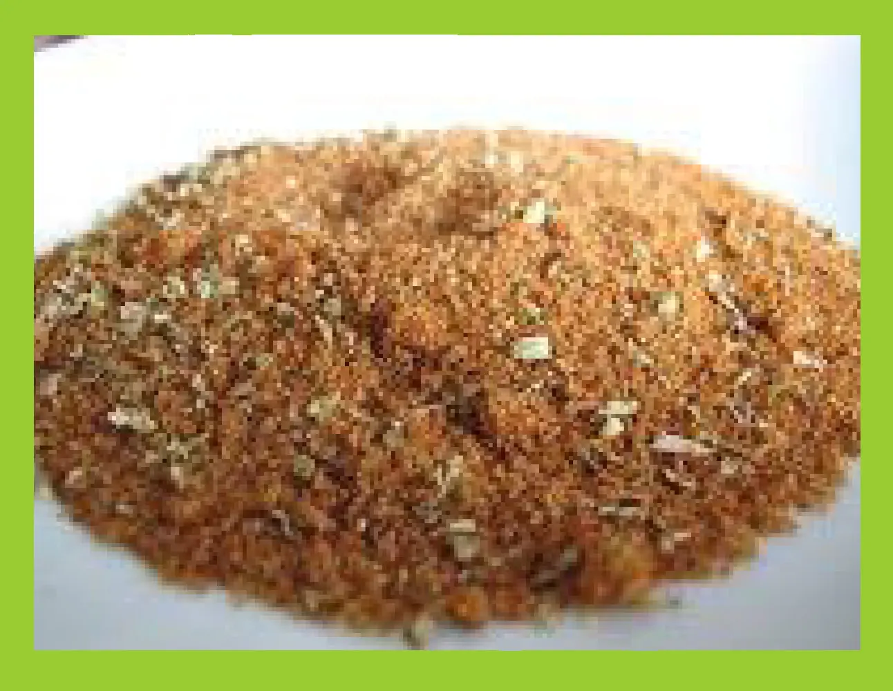 Pile of dry rub mixture with visible herbs and spices.